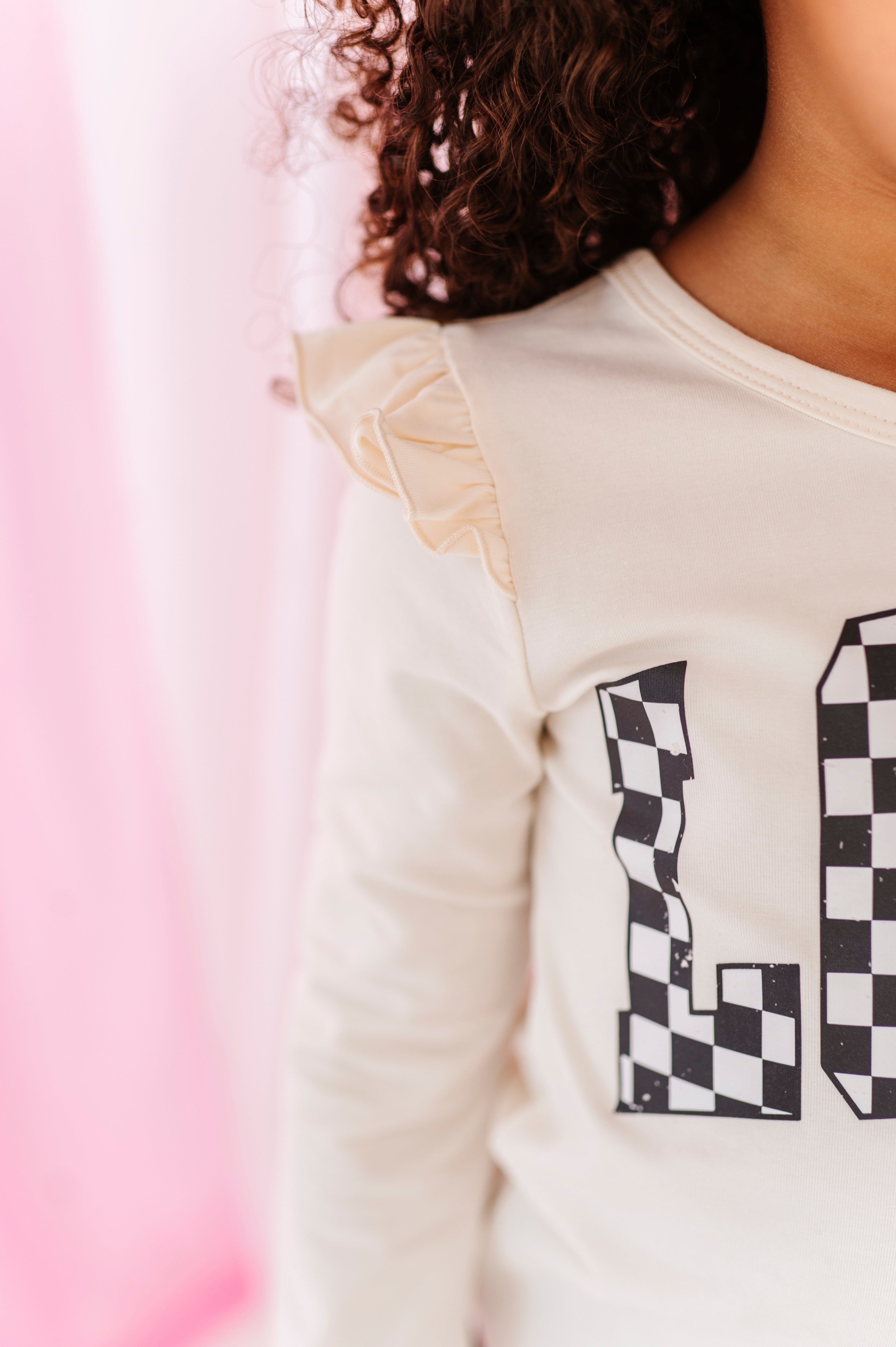 Checkered ‘LOVE’ | Cream Ruffle Long Sleeve